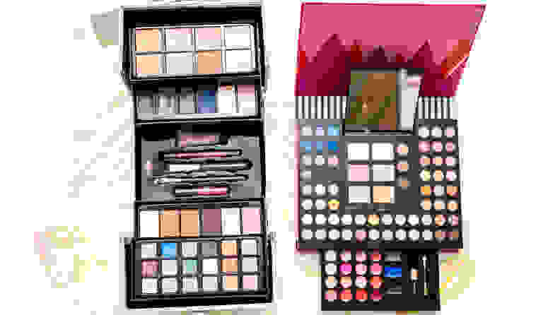 Two makeup kits sitting side by side open to reveal makeup.