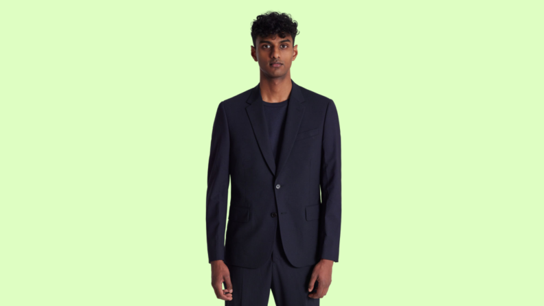 A model wearing a navy suit.