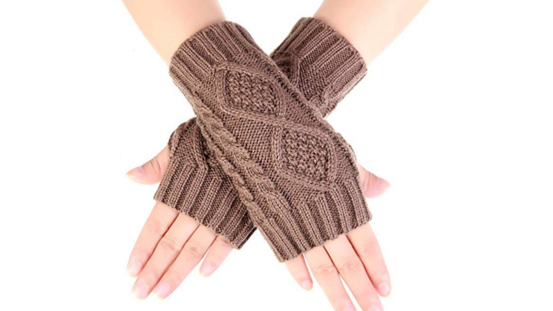 Image of two hands crossed over each other, wearing a pair of beige fingerless gloves.
