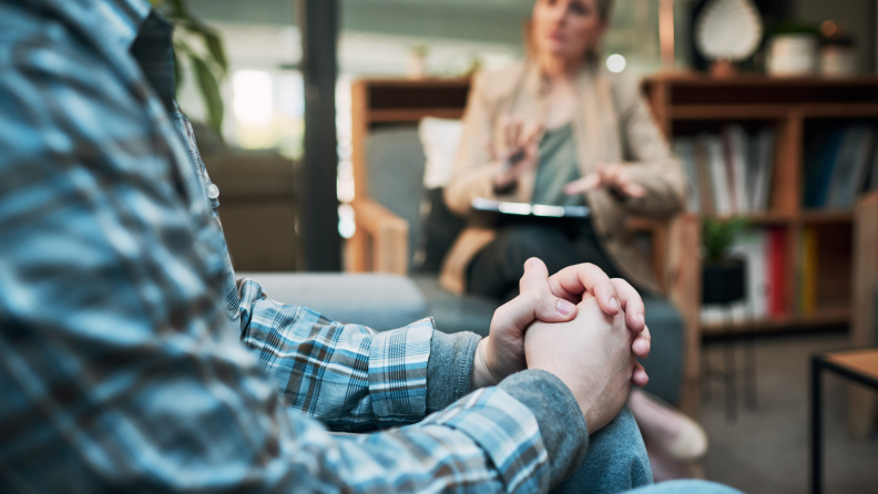 Person sitting down talking to their healthcare provider.