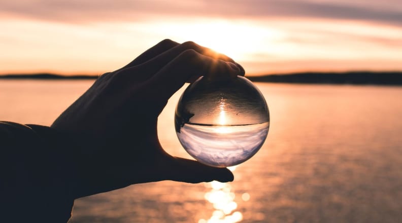 Hand holding crystal ball