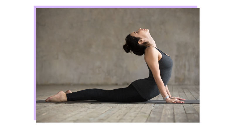 Person propped up on hands with legs stretched outwards on yoga mat.