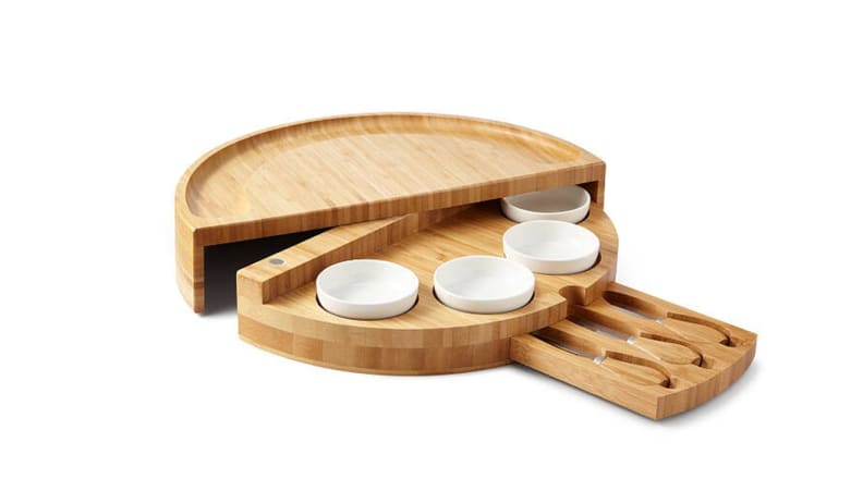 A wooden cheese board against a white background.