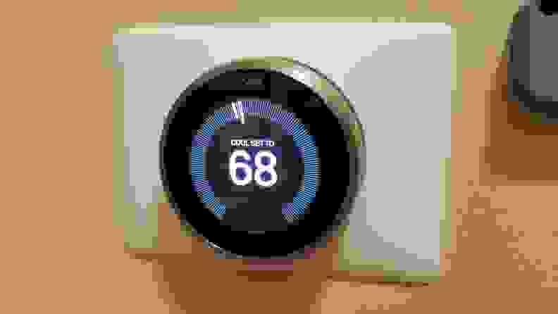 The Nest Learning Thermostat displays the temperature indoors.