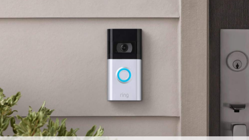 A Ring doorbell installed outside a front door.