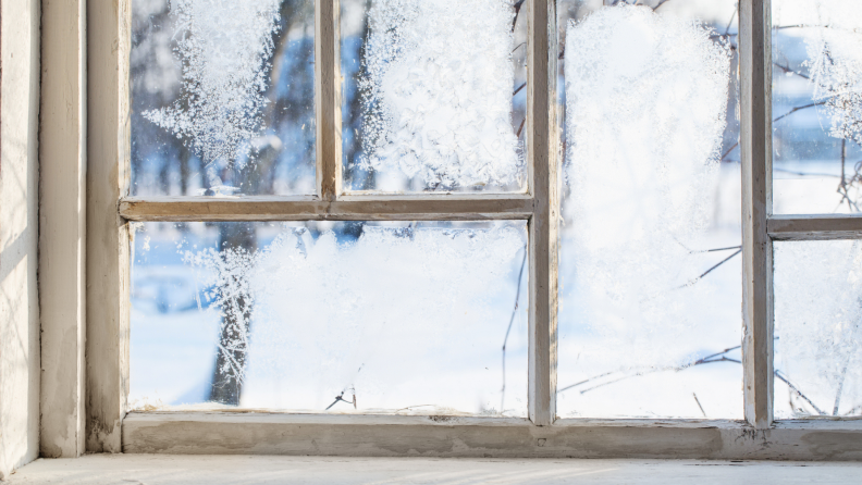 An older window with weathered window panes.