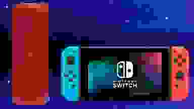 蓝色背景下的便携式蓝牙扬声器和任天堂Switch。