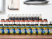 Four rows of jars in the Reviewed test lab kitchen: Vlasic Kosher Dill Speaers, 365 Marinara sauce, lemonade, and more.