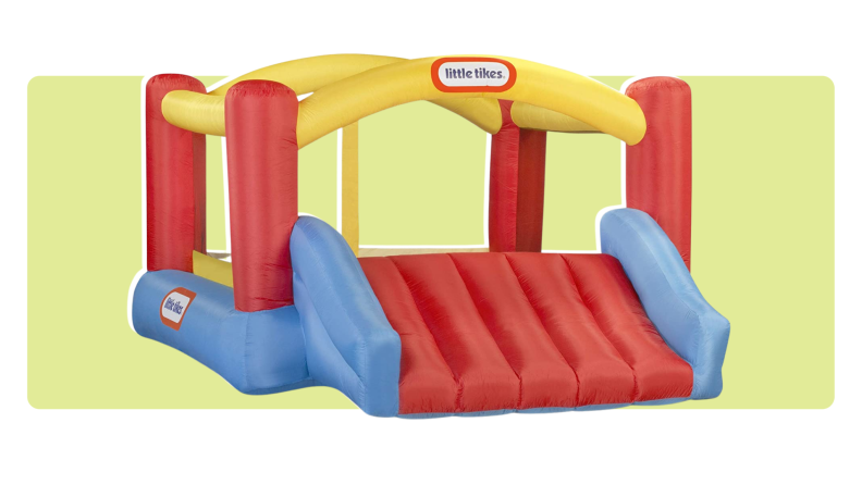 The Little Tikes Jump N’ Slide Inflatable Bouncer on a yellow background.