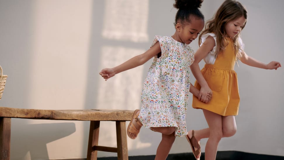 Two little girls playing hopscotch