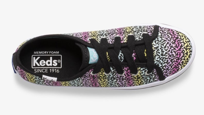 A colorful leopard print Keds shoe.