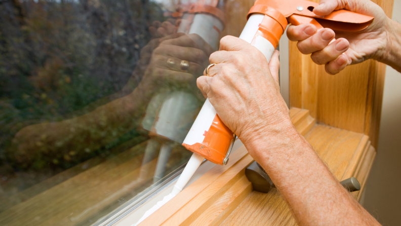 scrape away the window seal gasket connecting the glass to the window sash, and then install a new gasket or run a bead of silicone caulking around the seam, between the pane and the sash