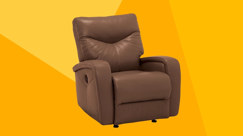 A brown leather recliner with an orange background.