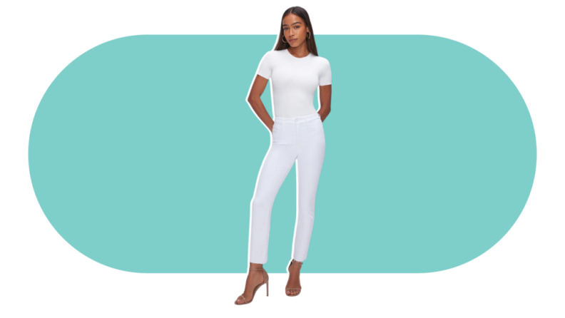 A model wearing the Good American Good Legs Straight Jeans in white.