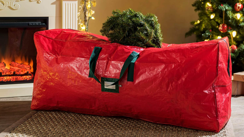 Red plastic Christmas tree bag on the floor