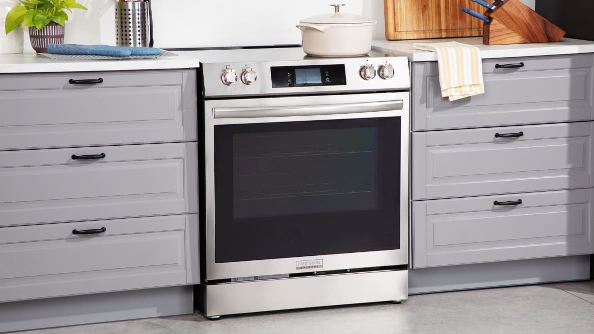 Frigidaire Gallery electric range surrounded by countertops in a kitchen set.