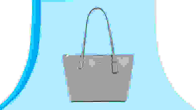 Pastel blue leather top handle purse from Coach.