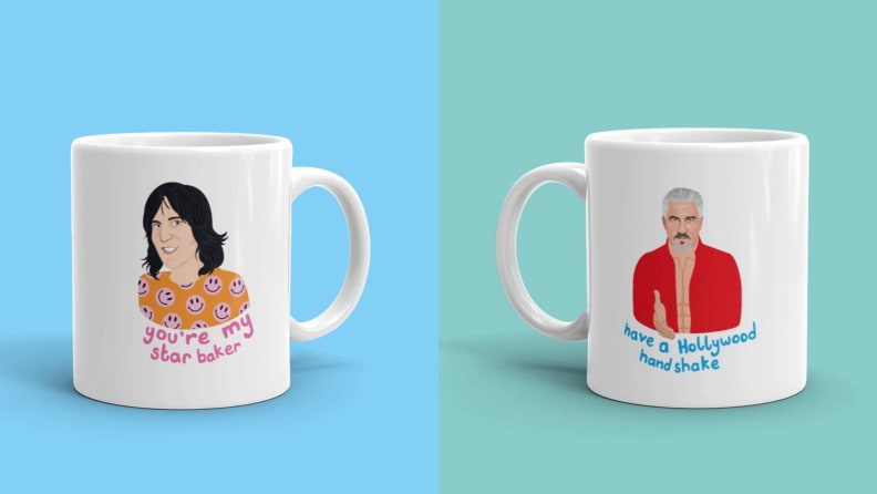 A pair of Great British Bake-Off coffee mugs. "Your my star baker," the one on the left reads. The one on the right says, "Have a Hollywood handshake."