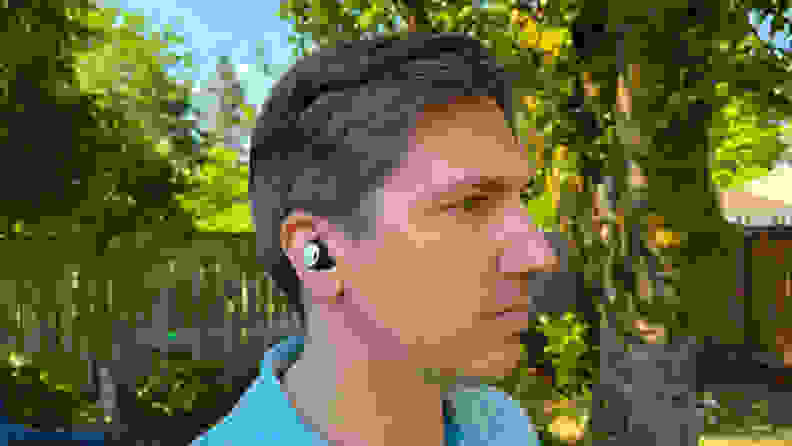 A far shot of a Pixel Bud Pro in a man's ear.