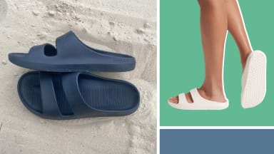 A pair of black slide sandals on sand, and the same sandals shown in white.