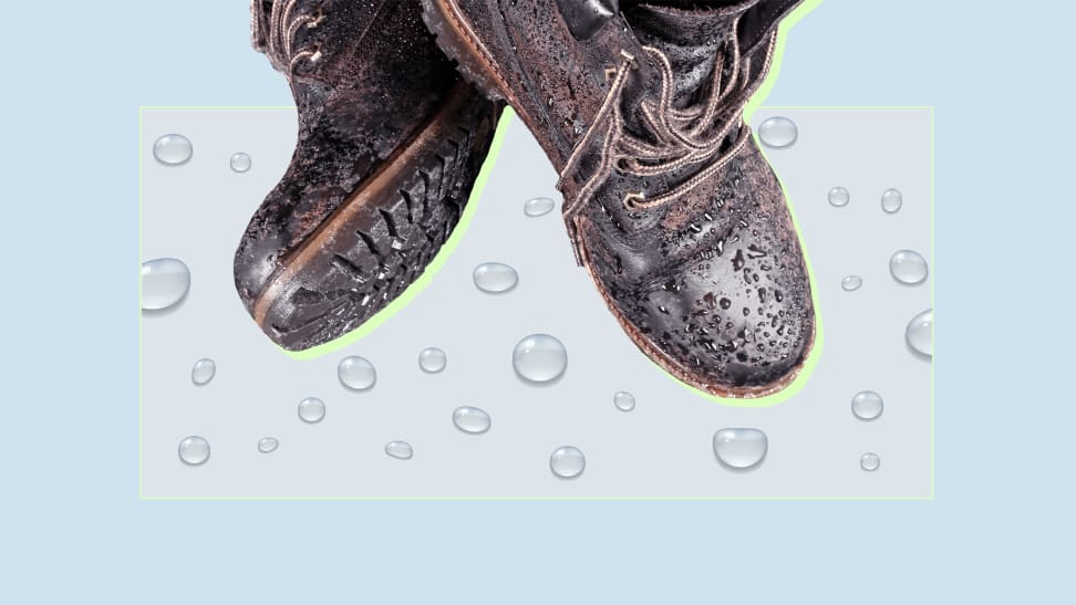 A pair of water-resistant boots against a blue background.