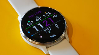 Garmin Venu 3 smartwatch with time displayed on watch face screen.