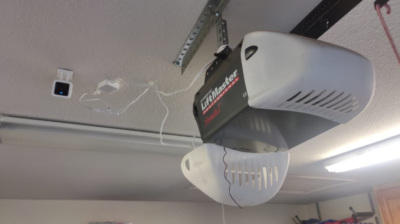 The Wyze camera set up next to the garage door operator.