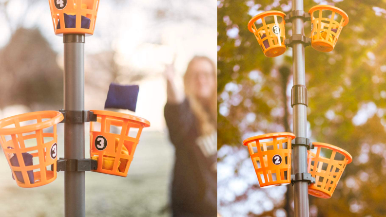 A person throws a bean bag into an orange cup outside.