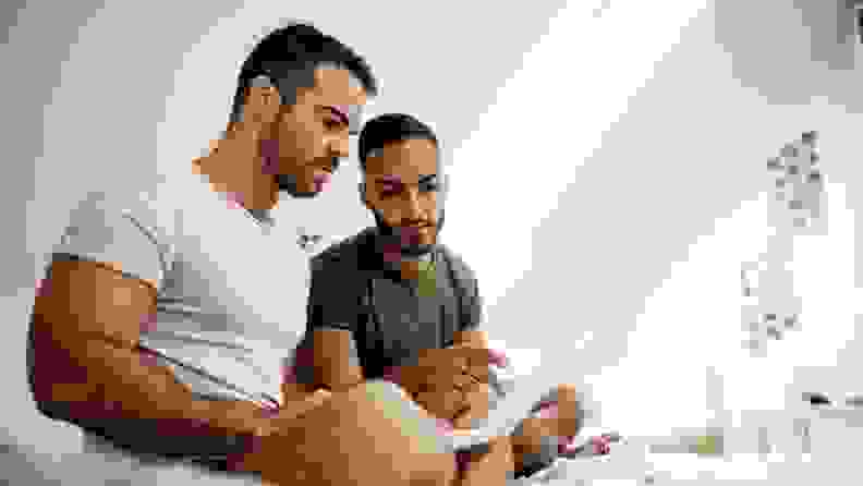 LGBT couple looking at computer screen