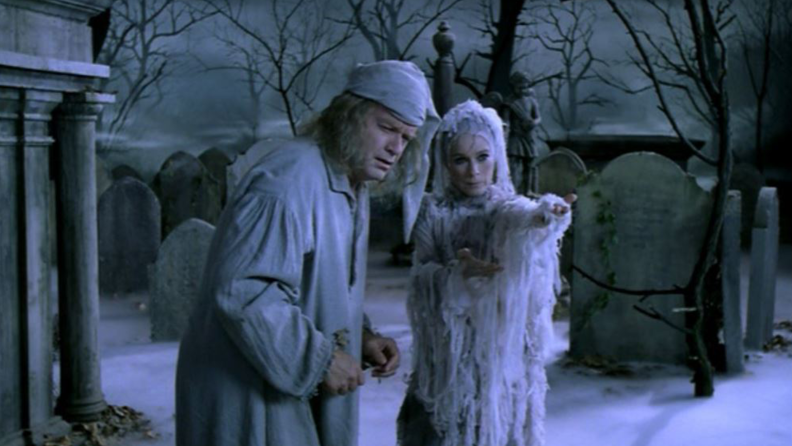 Kelsey Grammer (Scrooge) and Geraldine Chaplin (Ghost of Christmas Yet to Come) in a still from A Christmas Carol: The Musical.
