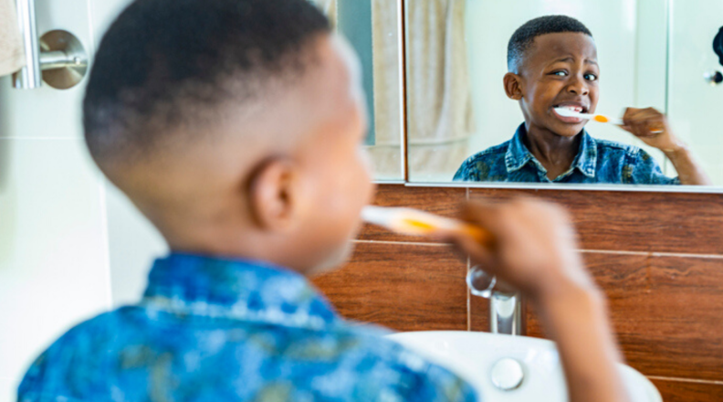 Child brushing teeth