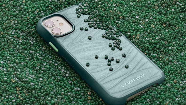 A green phone case surrounded by beads.