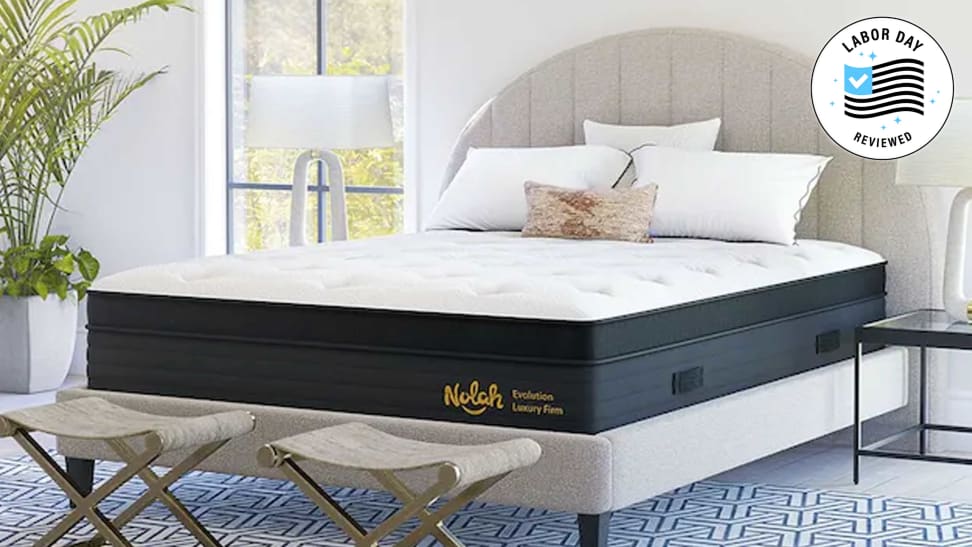 The Nolah Evolution mattress with Reviewed Labor Day badge in a bedroom setup.