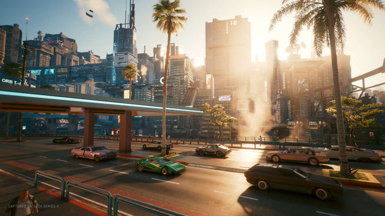 A screenshot from Cyberpunk 2077, showing Night City during the day.