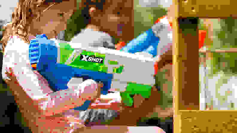 A girl uses the Zuru X-Shot Fast Fill water gun