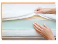Person using hand to feel foam section of mattress.