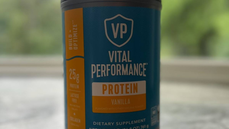 A blue and orange bottle of Vital Proteins Vital Performance Powder.