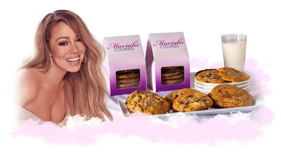 Mariah Carey poses next to her line of cookies.