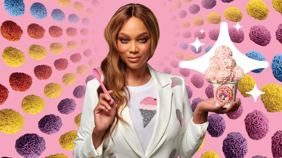 Supermodel Tyra Banks poses with scoops of pink ice cream surrounded by sprinkle-covered treats.