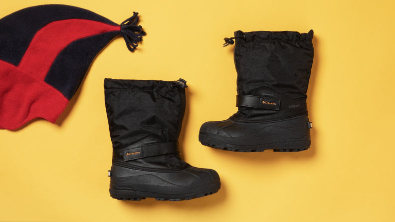 A pair of Columbia boots on a yellow background.
