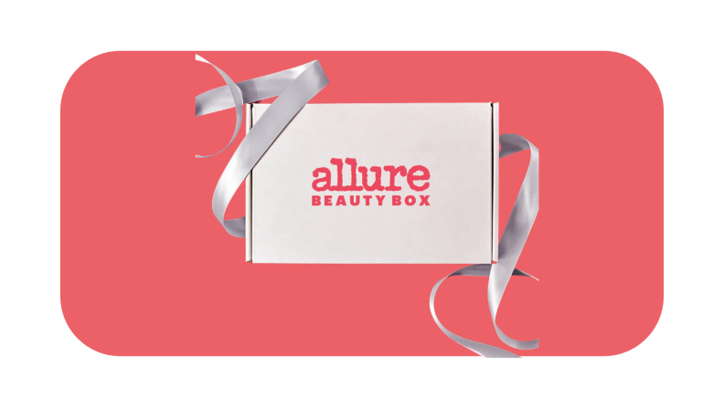 A white box with ribbon and "ALLURE" written on front surrounded with ribbon.