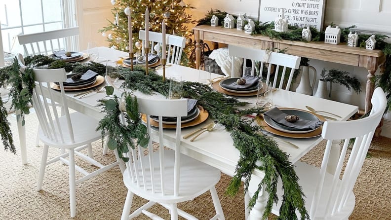 A dining table decorated for winter holidays.