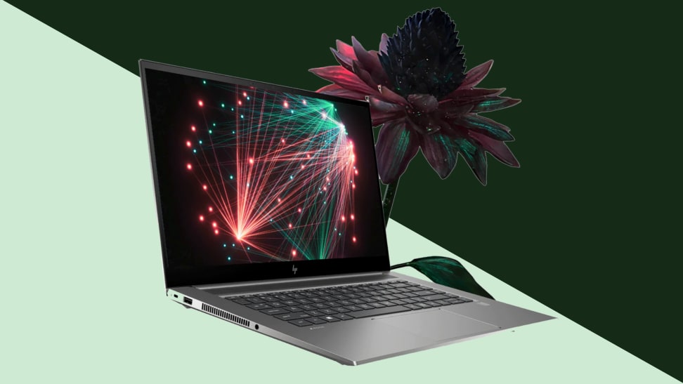 An image of an HP ZBook computer alongside a blooming, cosmic flower on a green and pale green background.