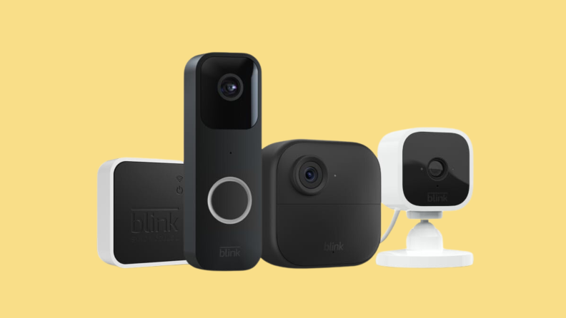 A collection of four Blink security camera devices on a yellow background.