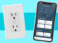 An outlet and a smartphone with an app displayed in front of a background.