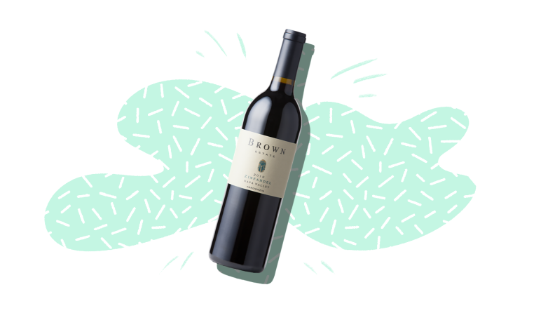 A silhouetted bottle of zinfandel wine on a mint and white patterned background.
