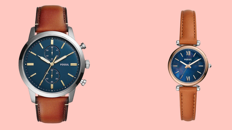 Fossil watches with leather bands on pink background.