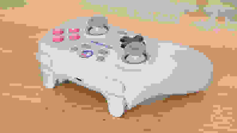 The GameSir Nova, a white controller with pink buttons on a table