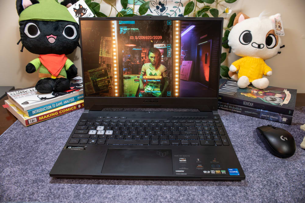 A black laptop with a colorful videogame on the screen