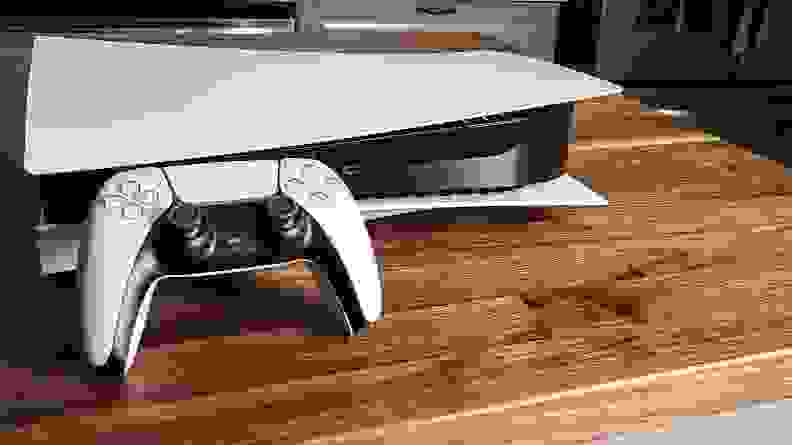 The playstation 5 and its controller on a table